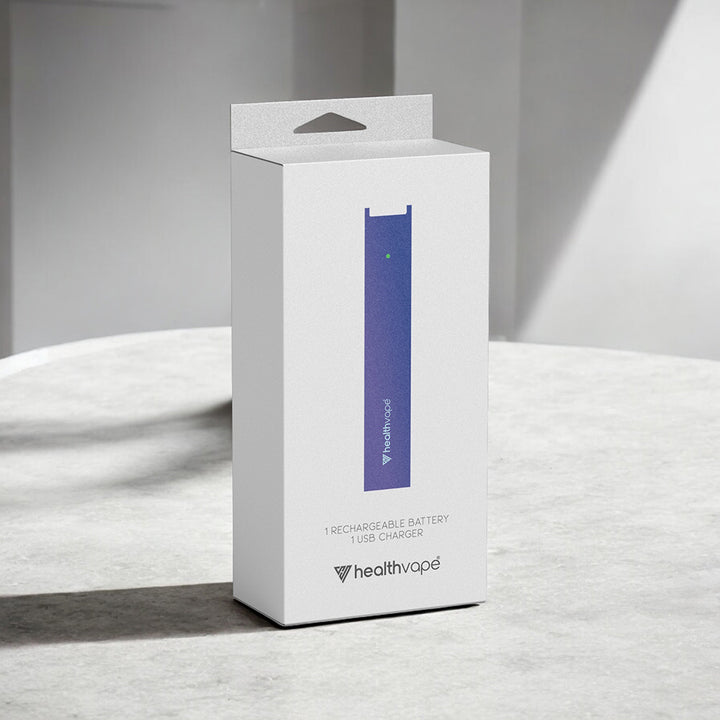 HealthVape rechargeable battery and charger kit box standing on a light stone surface.