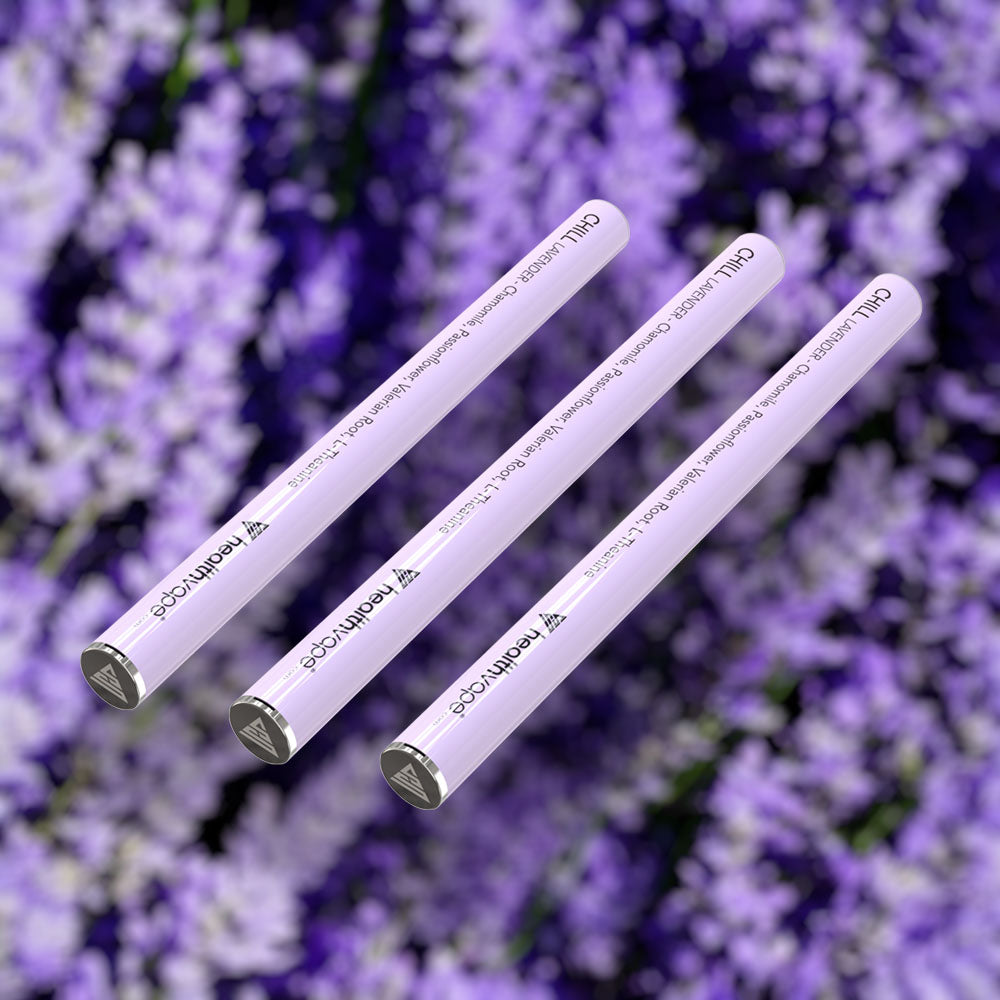 Three HealthVape CHILL Lavender chamomile pens on lavender flower background