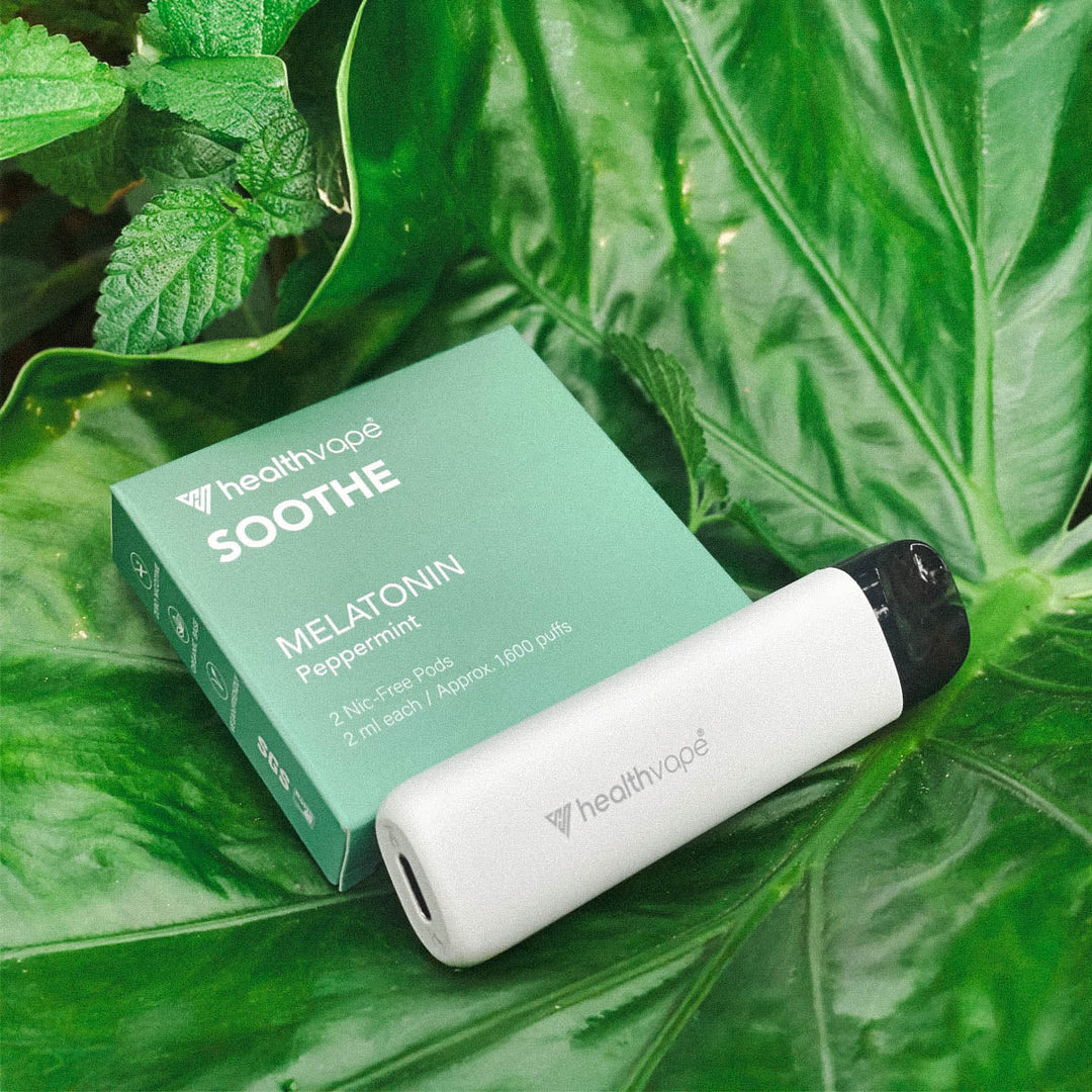HealthVape SOOTHE Peppermint pod box in outdoor setting with green plants